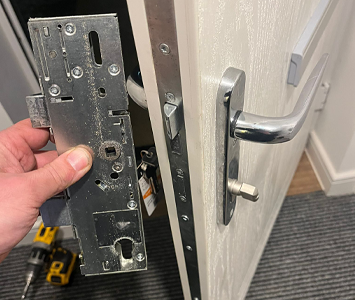 Composite door with replacement locking mechanism