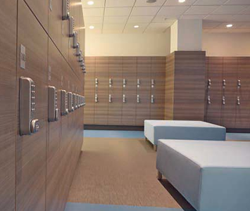 Gym changing room with lockers featuring electronic locks