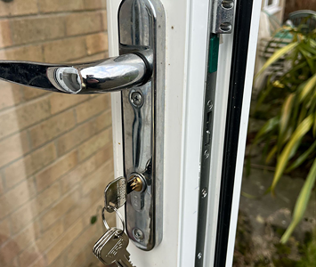 uPVC patio door with replacement handle, lock and key