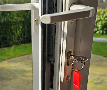 uPVC patio door featuring a replacement lock and key